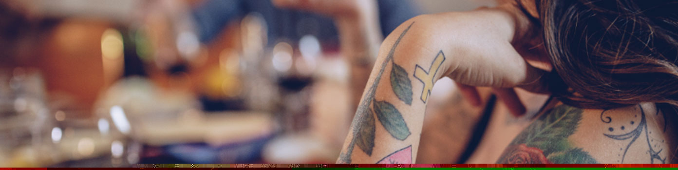 Person with tattoos on arm.