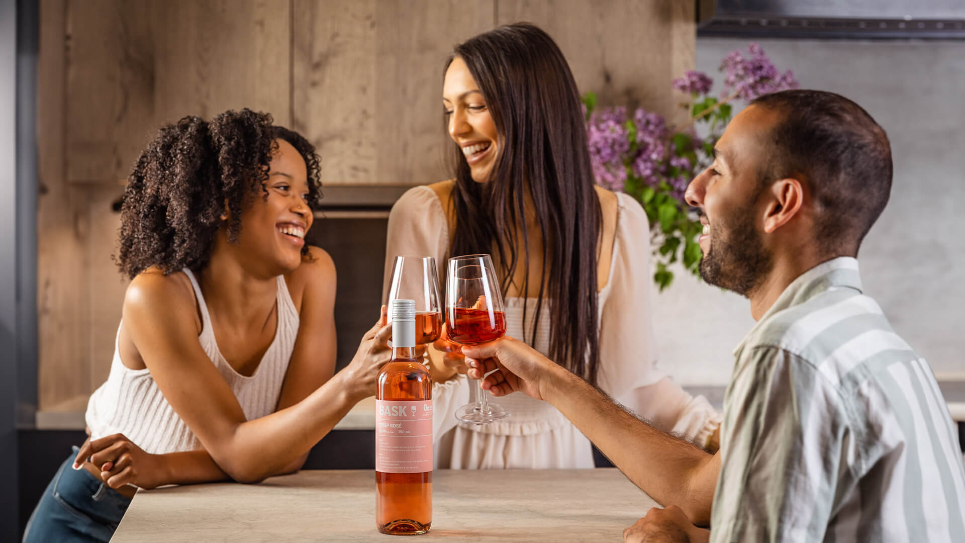 Friends enjoying a glass of Bask Rose. 