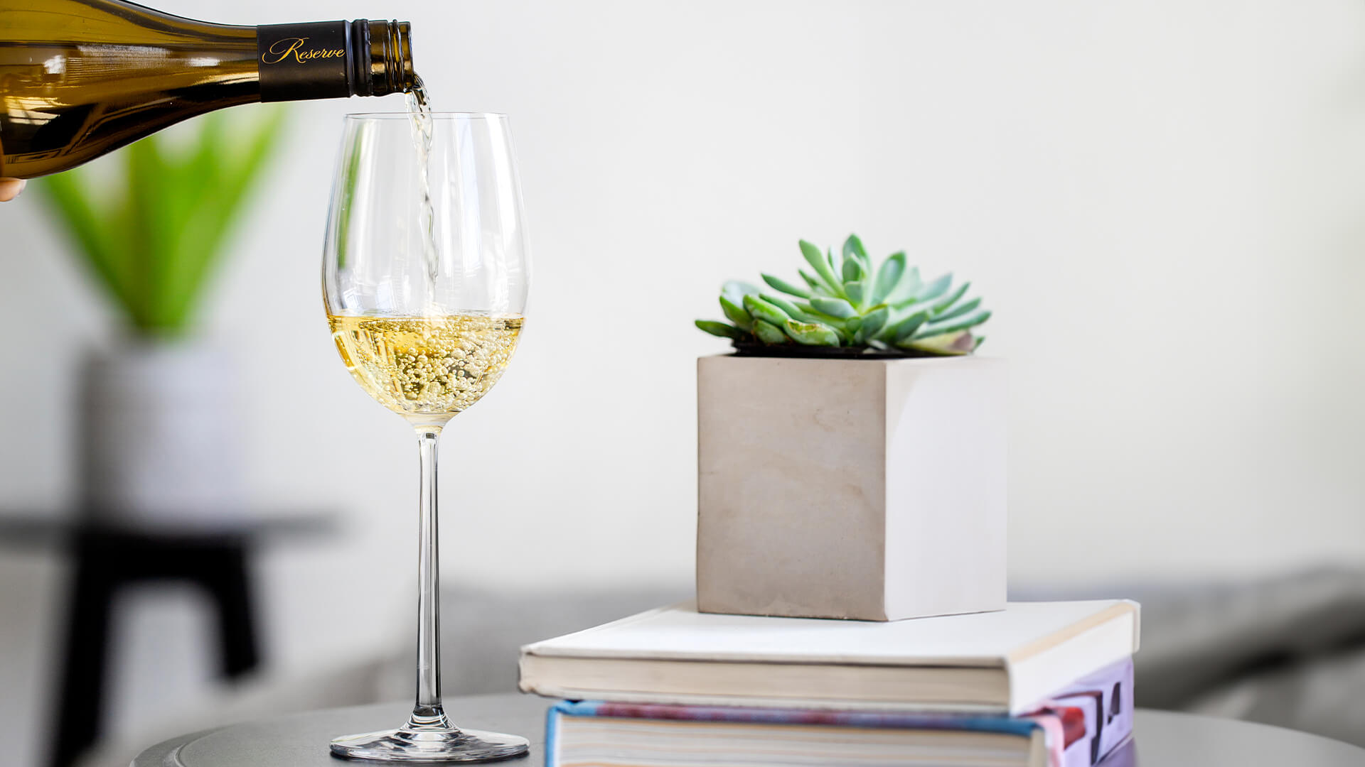 White wine being poured into a wine glass.